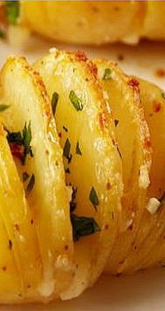 sliced potatoes with herbs and seasoning on them