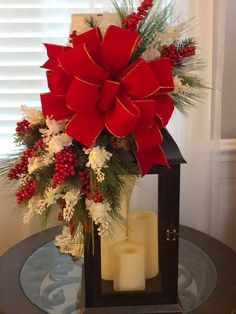 a christmas centerpiece with red and white flowers