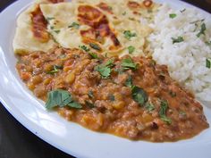 a white plate topped with rice and beans