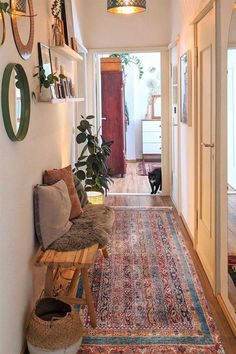 the hallway is clean and ready for guests to use it as an entrance way in this home