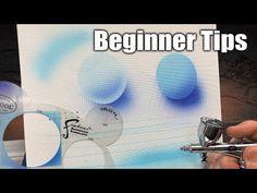 a person holding a pair of scissors in front of a painting with the words beginner tips