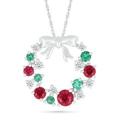 Dress your neck with this charming wreath pendant. Sterling silver Wreath -shaped design is scattered with lab-created rubies, lab-created emeralds and white lab-created sapphires A polished bow tops the design, completing the look 18.0-inch rope chain; spring-ring clasp Silver Wreath, Christmas Ring, White Lab, Lab Created Emerald, Holiday Jewelry, Rope Chain, Spring Rings, Lab, Ruby