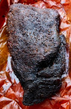 a piece of meat sitting on top of tin foil