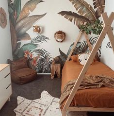 a bedroom with a bed, plant wallpaper and rugs on the floor in front of it