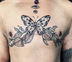 a man with a butterfly tattoo on his chest