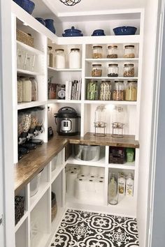 a pantry with lots of shelves and containers