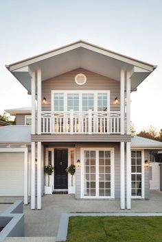 the front of a house with two garages