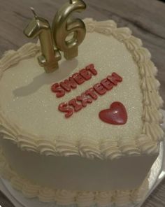 a heart shaped cake with the words sweet sister written on it and two small hearts