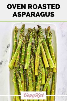 cooked asparagus in a white dish with text overlay