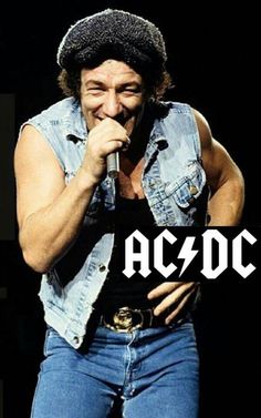 an image of a man singing on stage with the words ac / dc in front of him