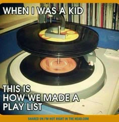 an old record player with the words when i was a kid, this is how we made a play list