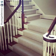 a set of stairs leading up to a second floor with carpet on the treads