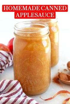 three jars filled with peanut butter sitting on top of a white counter next to spoons