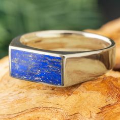 This handmade signet ring for men exudes minimalist luxury with its natural blue lapis lazuli stone and choice of gold colors. Enjoy the timeless look of this classic ring design with a colorful, nature-inspired twist! RING LAYOUTRing Width: 8mm Tapered to 5mmRing Sleeve: 14k GoldRing Profile: FlatRing Finish: Polished 0.75 mm 14k Gold6.5 mm Lapis Lazuli0.75 mm 14k Gold Signet Ring For Men, Engraved Wedding Rings, Minimalist Luxury, Lapis Lazuli Ring, Blue Lapis Lazuli, Lapis Lazuli Stone, Yellow Gold Jewelry, Twist Ring, Ring For Men