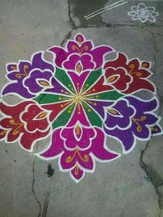 a colorful flower design painted on the ground