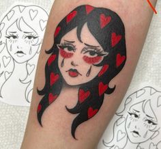 a woman's face with red hearts on her eyes is shown in this tattoo design