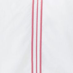 two pink pins are attached to the back of a white shirt