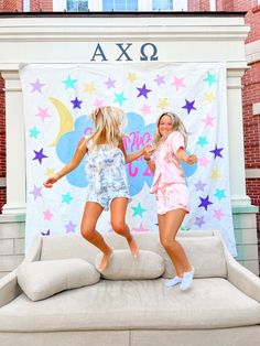 Two girls jumping on a couch in colorful pjs. Meant to be cute, fun, playful, and candid for a photo inspiration and pic ideas. Slumber Party Sorority Theme, Slumber Party Bid Day Theme, Alpha Chi Omega Recruitment, Dreaming Of Pc Sorority, Recruitment Workshop Ideas Sorority, Pajama Sorority Theme, Spirit Week Sorority, Sorority Spirit Week