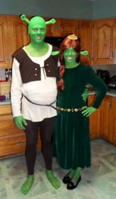 two people in costumes standing next to each other