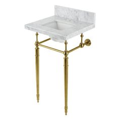 a bathroom sink with gold fixtures and a white marble counter top on an antique brass stand