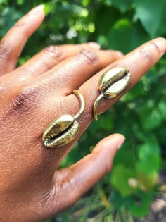 This is a fly statement ring for sure!  Raw Brass Cowrie Shell Ring.  Created with high quality materials using the West African jewelry technique.  Adjustable but great for a size 6 or 7.  (I use really solid materials to create it but it can be adjusted with a little strength) 💫Created by hand so the craftsmanship and uniqueness is present 💫 Only one available  🌙Moon Goddess items are created with raw brass materials. Brass jewelry is known to have metaphysical energy and to enhance the flo Afro Jewelry, Dope Jewelry Accessories, Natural Cleaners, Body Jewelry Piercing, Shell Ring, Dope Jewelry, Jewelry Techniques, African Jewelry, Moon Goddess