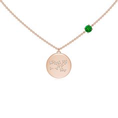 a gold necklace with the word love on it and a green stone in the middle