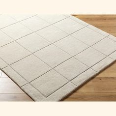 a white rug with squares on top of it