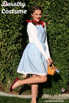 a woman wearing a blue dress and red shoes