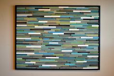 a painting on the wall that looks like it is made out of strips of wood