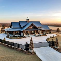 a large house with a lot of windows and lots of trees