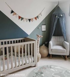 a baby's room with a crib, chair and bed