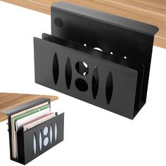 two black folders are next to each other on a wooden table and one is holding files