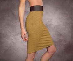 Crafted from luxurious, soft fabric, this skirt hugs your curves in all the right places while allowing easy movement. Perfect for both office chic and evening sophistication. Available in various sizes and colors. Pair with our matching crop top tee or mix and match! .: 95% Polyester 5% Spandex .: Mid waist fit .: Printed on care label in black color .: White thread color .: Assembled in the USA from globally sourced parts Brown Pencil Skirt, Pencil Skirt Work, Knee Length Skirt Pencil, Crop Top Tees, Chic Office, Midi Skirt Pencil, Retro Look, Skirt, Soft Fabrics