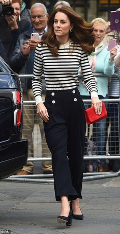 the duke and duchess of cambridge are seen walking down the street