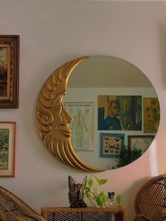 a mirror that is on the side of a wall next to a wicker chair