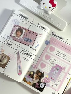 an open hello kitty planner with stickers on it