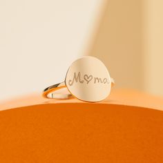 Symbolic and personal, our Personalized Signet Ring is a contemporary take on the traditional design, and is hand-engraved to create the perfect jewelry gift.18K Champagne Gold Plated or 925 Sterling SilverHand-engraved in our Paris workshopSent with love in a complimentary gift boxAny slight variations in lettering depth, spacing and alignment from the examples shown are part of the aesthetic and originality of the piece Promise Sterling Silver Ring With Engraved Text, Promise Sterling Silver Engraved Ring, Personalized Engraved Rose Gold Ring, Modern White Gold Rings For Gift, Modern White Gold Rings For Gifts, Minimalist Signet Ring With Engraving For Promise, Minimalist Promise Signet Ring With Engraving Option, Personalized Minimalist Engraved Ring As A Gift, Adjustable Polished Signet Ring Gift