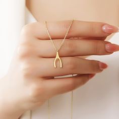 Your Wishbone Pendant is stylish, dainty and pretty ideal for everyday use. Details of solid gold handmade Minimal Wishbone Necklace are very eye-catching. It is a great gift for your loved ones. This jewelry will be an indispensable piece of yours. This meaningful Dainty Gold Charm Necklace with high quality handwork will be a legacy you can leave to your family its.  * Gold Wishbone Necklace Details * Material / Gold Kt : This elegant necklace is made of 14k and 18k Solid Gold * Available Gold Colors : Yellow Gold, White Gold, Rose Gold * Pendant Height : 15.90 mm * Pendant Width : 8.10 mm * Chain Length Options :  - 14 Inches - 35,56 cm - 15 Inches - 38,10 cm - 16 Inches - 40,64 cm - 17 Inches - 43,18 cm - 18 Inches - 45,72 cm - 19 Inches - 48,26 cm - 20 Inches - 50,80 cm - 21 Inches - Wishbone Necklace Gold, Wishbone Necklace, Gold Charm Necklace, Rose Gold Pendant, Elegant Necklace, Birthday Gift For Her, Elegant Necklaces, Gold Charm, Birthday Gifts For Her