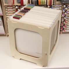 an old tv sitting on top of a table in front of some bookshelves