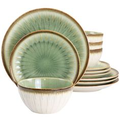 a set of four green and white dishes