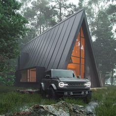 a black truck is parked in front of a house with a roof made of metal