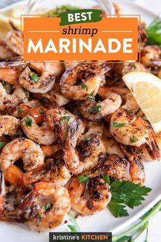 the best shrimp marinade is served on a white plate with lemon wedges and parsley