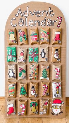 a wooden calendar with christmas decorations on it