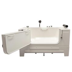 a white bath tub sitting next to a sink