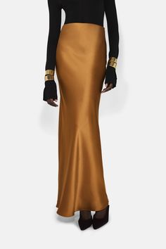 The Valletta Satin Skirt is the epitome of understated elegance, cut on the bias for a flattering skim over natural curves. Galvan London, Satin Maxi Skirt, Gold Skirt, Jumpsuit And Blazer, London Style, Bridal Jumpsuit, Bridal Separates, Spring 2025, Eve Outfit