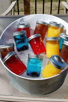 a tin can filled with mason jar cocktails