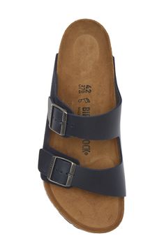 A leather slide sandal is made with Birkenstock's legendary footbed that mimics the shape of your foot and provides excellent support. Support: enhances the fit with targeted contouring and cushioning in the footbed Cushioning: absorbs impact and distributes weight for consistent, buoyant comfort under each step Contoured footbed with arch support Leather upper and lining/synthetic sole Made in Germany Classic Double Strap Slides With Cushioned Footbed, Classic Slide Sandals With Cushioned Footbed, Classic Slide Footbed Sandals With Cushioned Footbed, Classic Leather Footbed Sandals With Arch Support, Classic Cushioned Slide Footbed Sandals, Leather Double Strap Slides With Cushioned Footbed, Leather Slides With Double Strap And Cushioned Footbed, Adjustable Slides With Leather Footbed, Adjustable Leather Footbed Slides