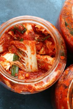 several jars filled with different types of food