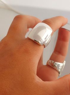 Wide Silver Ring, Statement Ring, Sterling Silver, Wide Dome Ring, Wide Band Ring, Modernist Ring, Chunky Dome Ring, Full Finger Ring Modern and Chic in Design, this Statement Dome Ring is stunning. Perfect on it's own and just may be the only ring you need. 100% Handmade   100%  Sterling Silver  Width 18.2 mm  Length 25.0 mm Weight 18.0  grams (Weight may vary by size) Μade to order  Free shipping Tracking number  Elegant gift box and gift bag Accepted return for resizing  Acceptable return for Full Finger Ring, Moon Shine, Full Finger Rings, Wide Silver Ring, Chunky Silver Rings, Modernist Ring, Wide Band Ring, Dome Ring, Wide Band Rings