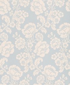 a blue and white wallpaper with flowers on it